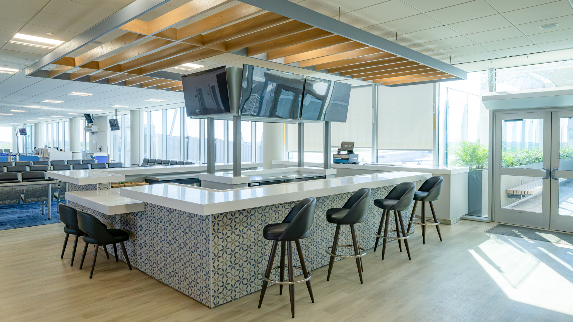 Airport bar area with counter and bar stools