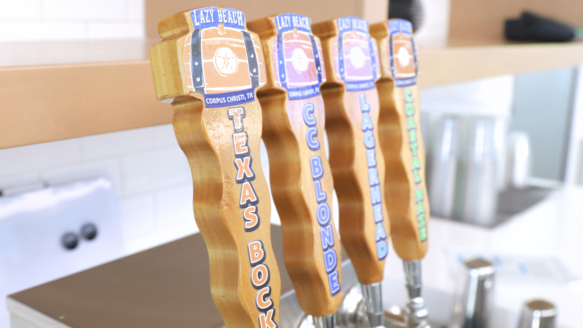 photo of beer taps, lazy beach brewing